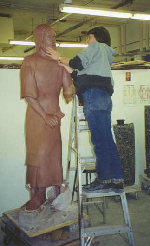 Alice Manzi working on sculpture of St. Joseph